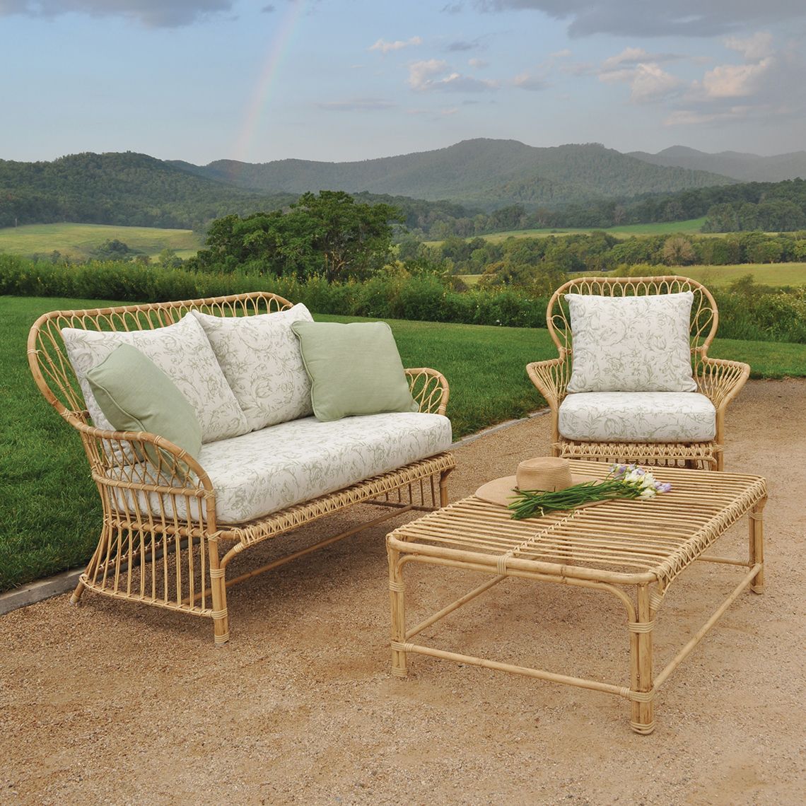 The Savannah Coffee Table brings sophisticated mid-century style to outdoor spaces with hand-woven all-weather wicker over aluminum frames. Its clear tempered glass top and weather-resistant construction make it ideal for poolside and coastal environments. - alternate view