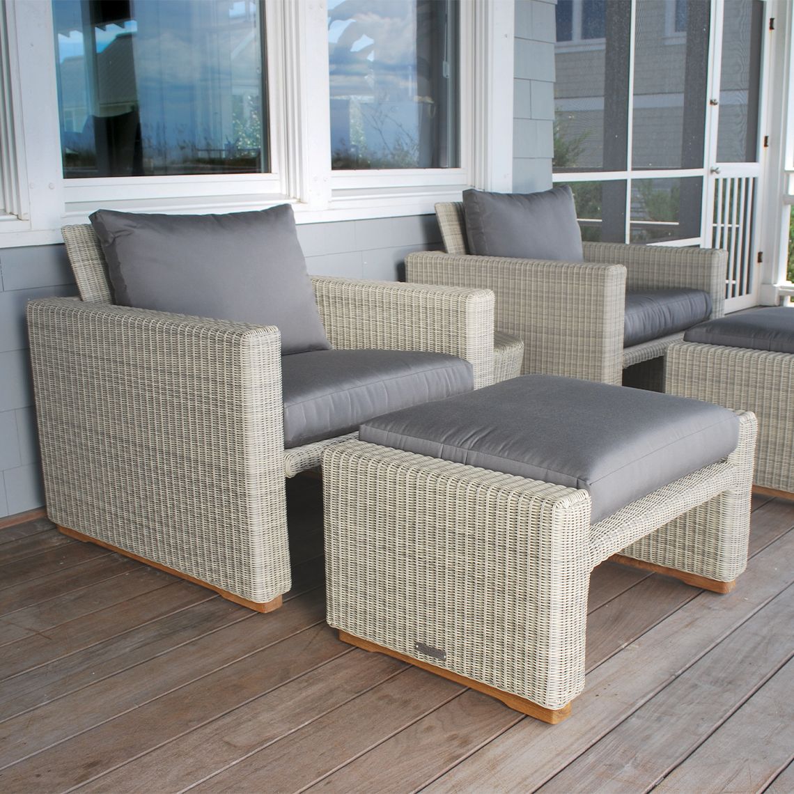 The Westport Ottoman, crafted from hand-woven all-weather wicker. Features streamlined simplicity with solid teak bases. Find a dealer near you. - alternate view