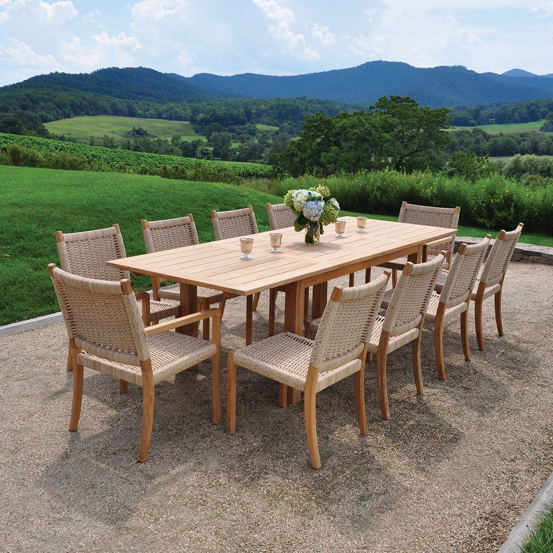 A versatile outdoor dining solution that expands from 70" to 102" with self-storing leaves. Grade A teak construction ensures durability in diverse weather conditions while the coastal-inspired design complements various chair styles. - alternate view