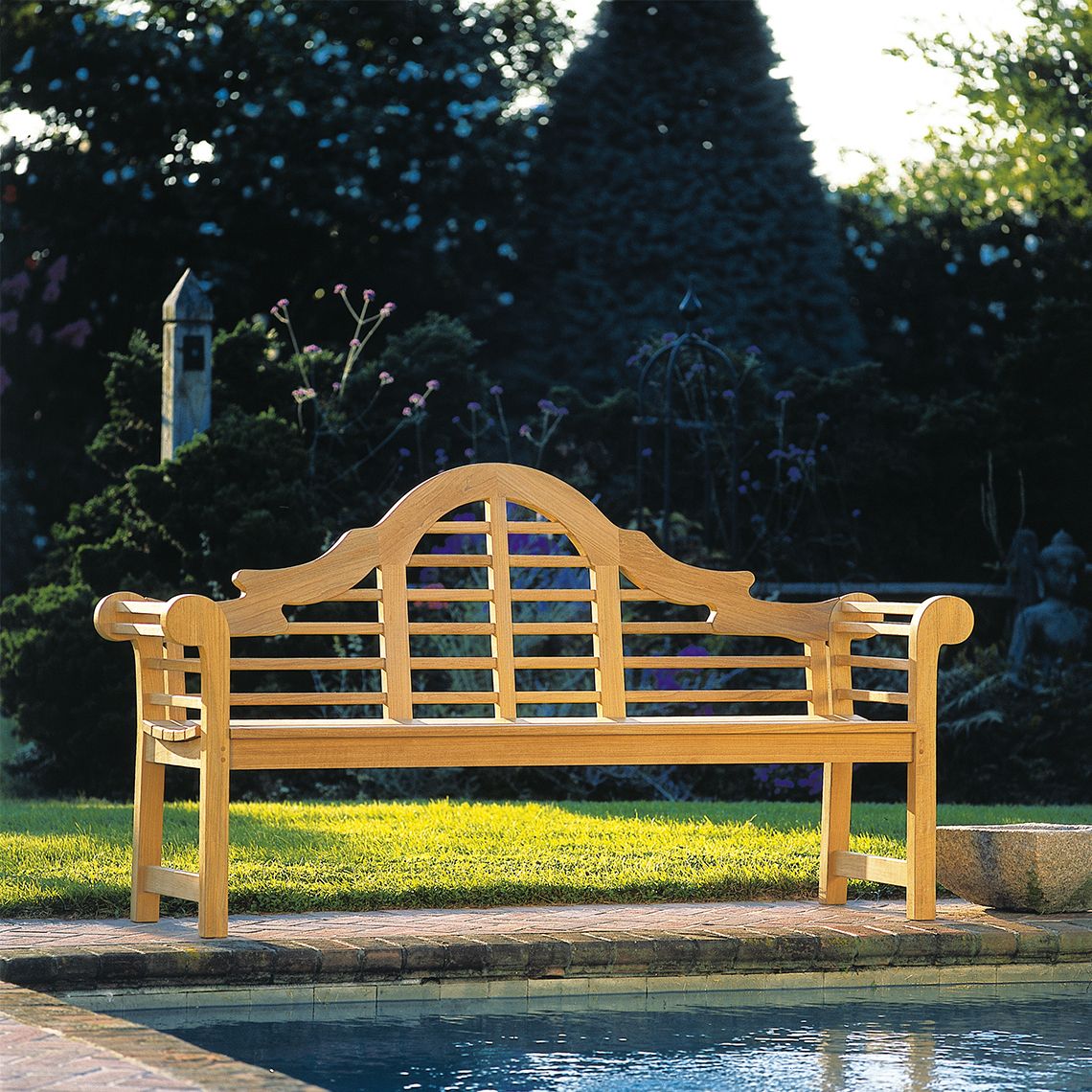 An iconic outdoor bench that combines timeless English garden design with exceptional durability. Grade A teak construction ensures weather resistance across all climates, from salt air to snow. - alternate view