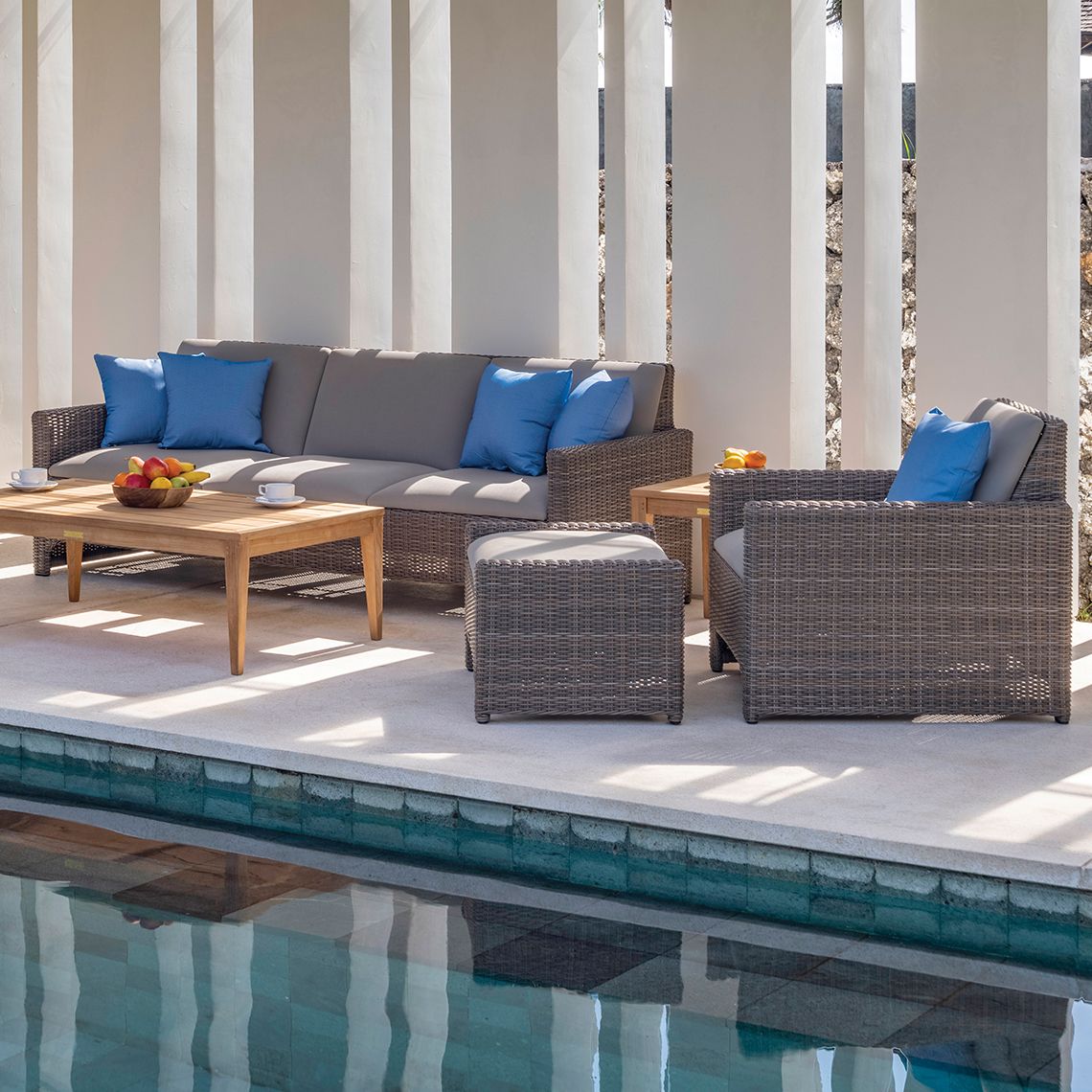 The Milano Lounge Chair combines artisanal hand-woven wicker with modern upholstered sling seating for exceptional outdoor comfort. Its durable, fade-resistant construction and replaceable decking make it ideal for high-use residential and hospitality settings. - alternate view