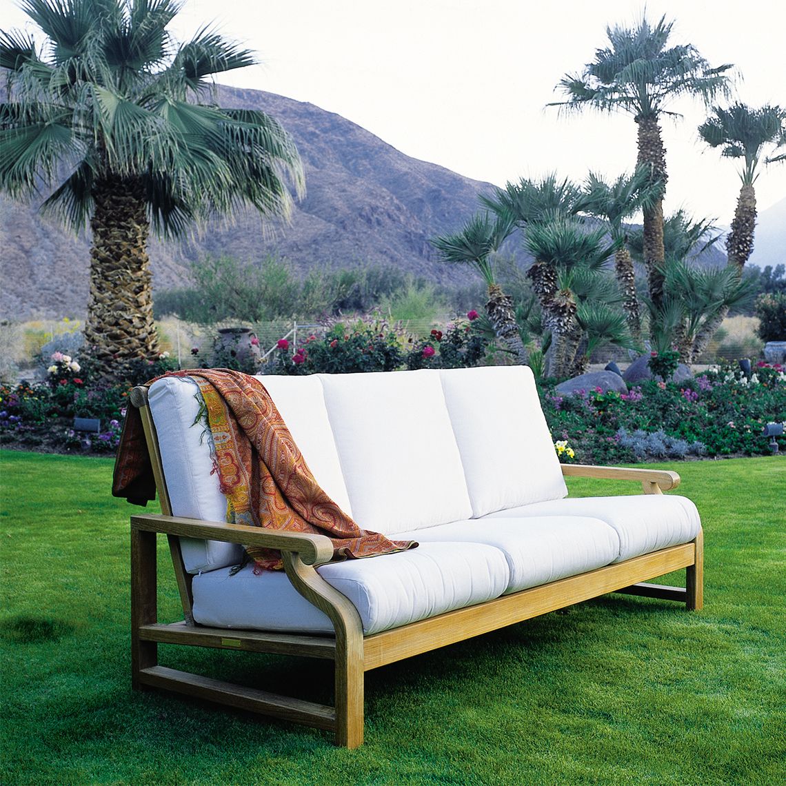 The Nantucket Sofa combines traditional design with exceptional outdoor durability. Grade A teak construction and solid brass hardware deliver timeless elegance that weathers beautifully in any climate. - alternate view