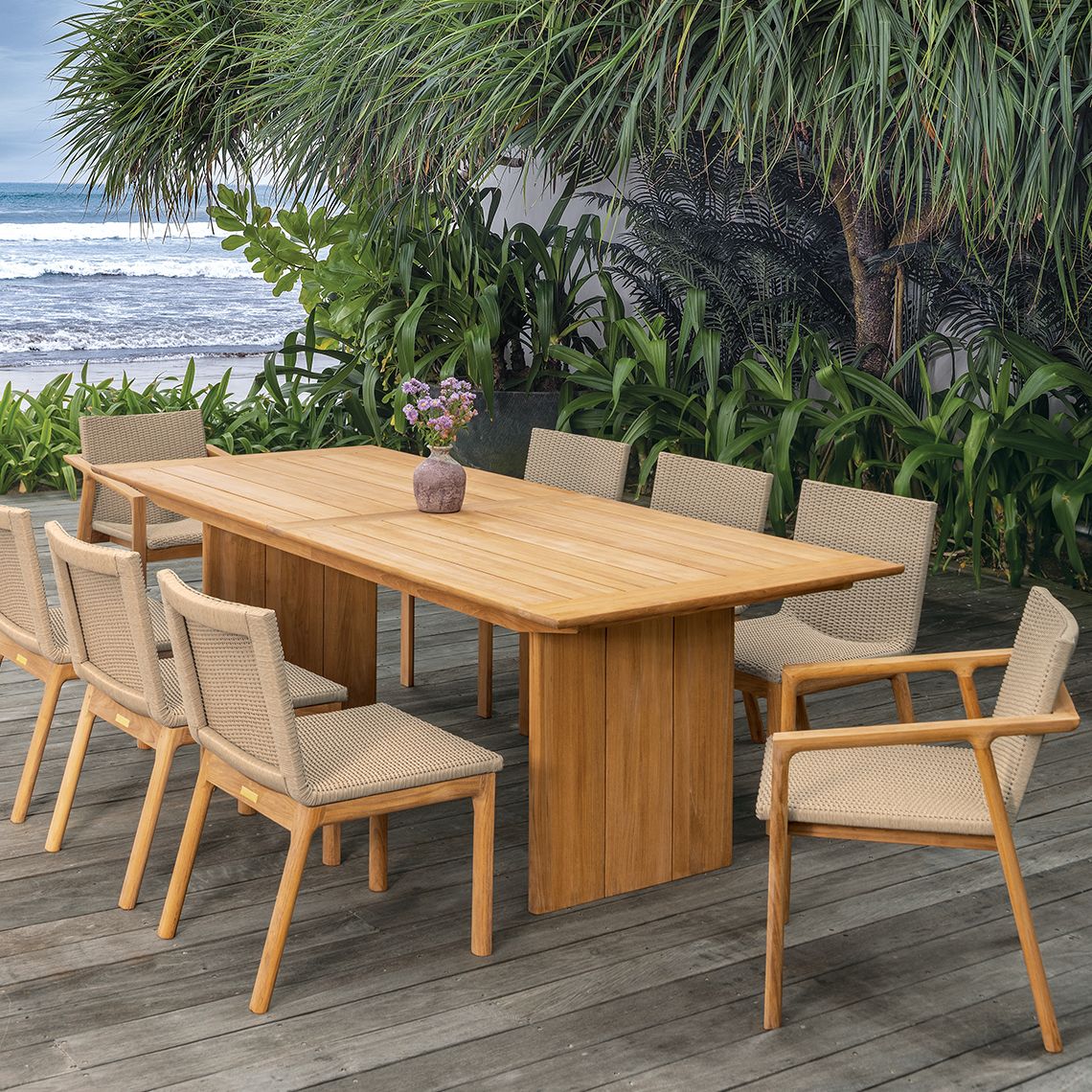 The Cortona 96" dining table combines refined elegance with weather-resistant durability. Crafted from solid Grade A teak, it's built to withstand diverse climates including salt-air, rain, and snow while maintaining its beauty. - alternate view