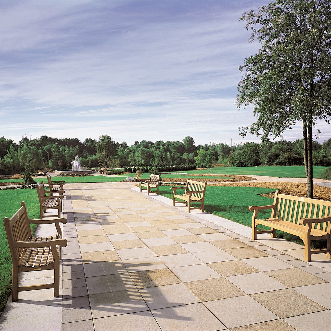 The Hyde Park 6' Bench delivers timeless design and exceptional durability with solid Grade A teak construction. Its classic proportions and weather-resistant build make it ideal for both residential patios and commercial settings. - alternate view