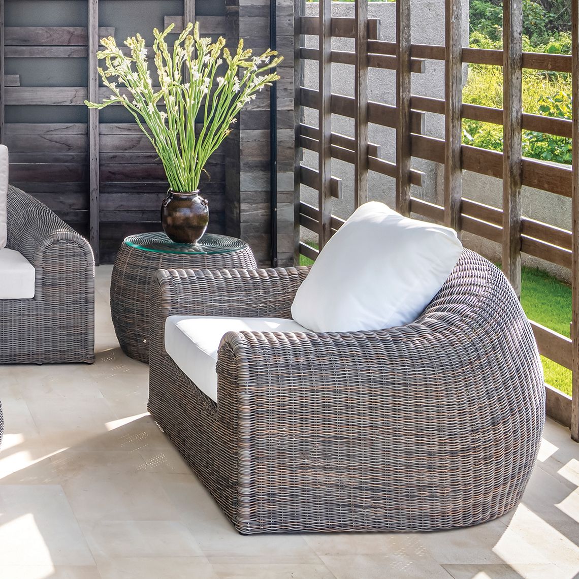 The Ojai Lounge Chair delivers iconic mid-century design with hand-woven wicker over aluminum frames. Low, comfortable seating perfect for poolside lounging and coastal living spaces. - alternate view