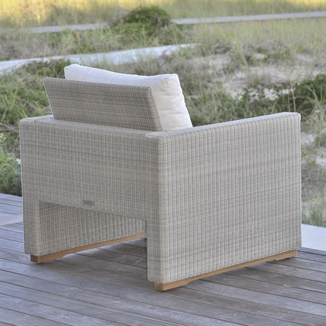 The Westport Lounge Chair, crafted from hand-woven wicker. Features streamlined simplicity with solid teak bases. By Kingsley Bate. Find a dealer near you. - alternate view