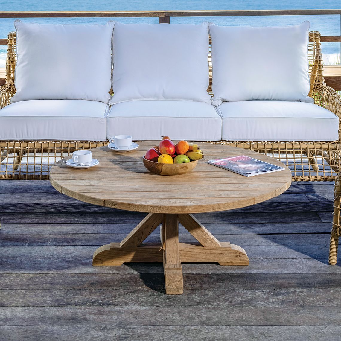 The Provence Coffee Table brings old-world European charm to outdoor living spaces with its distressed teak construction. Built to withstand diverse climates including salt air, rain, and snow, this 42-inch round table pairs beautifully with outdoor seating arrangements. - alternate view