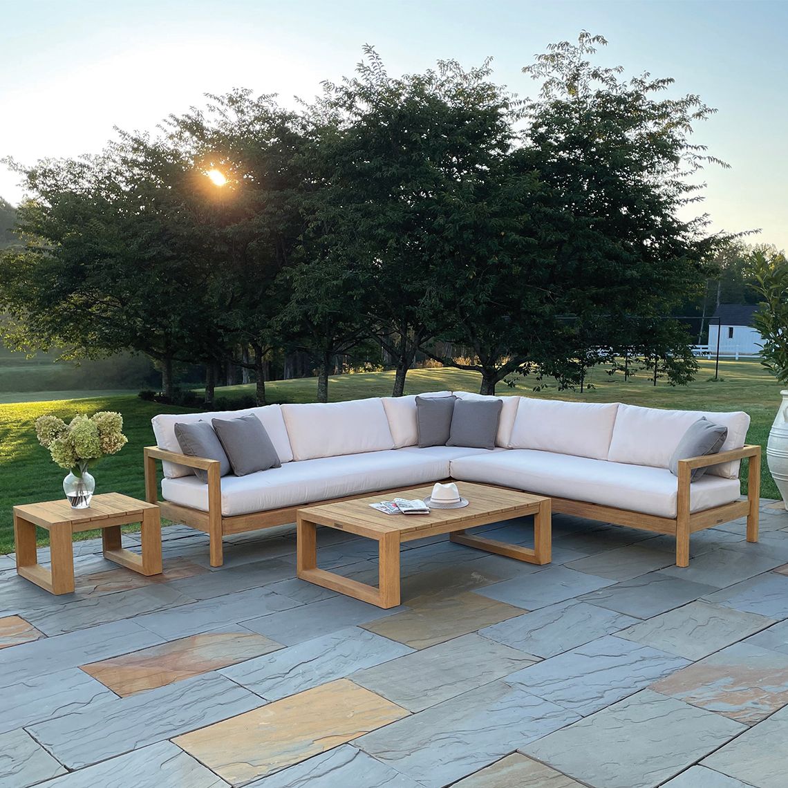 The Montauk Coffee Table combines durability with coastal charm. Crafted from distressed teak, it's built to withstand diverse weather conditions including salt air, rain, and snow, making it ideal for year-round outdoor use. - alternate view