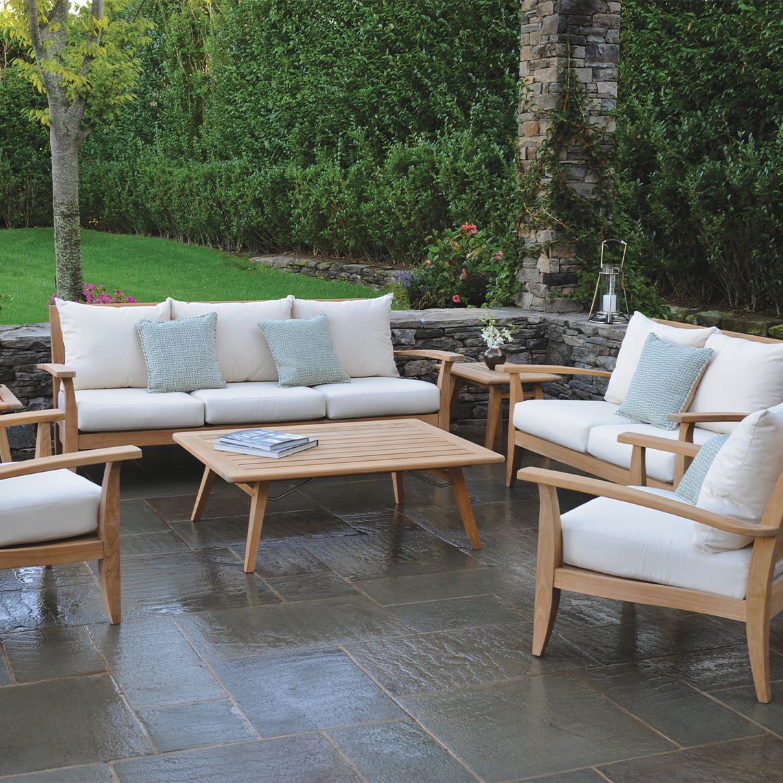 The Ipanema Sofa combines Danish modern aesthetics with California contemporary style in solid Grade A teak. Built to withstand diverse weather conditions including salt air, rain, and snow, this 84-inch sofa offers durability and timeless design for outdoor living spaces. - alternate view
