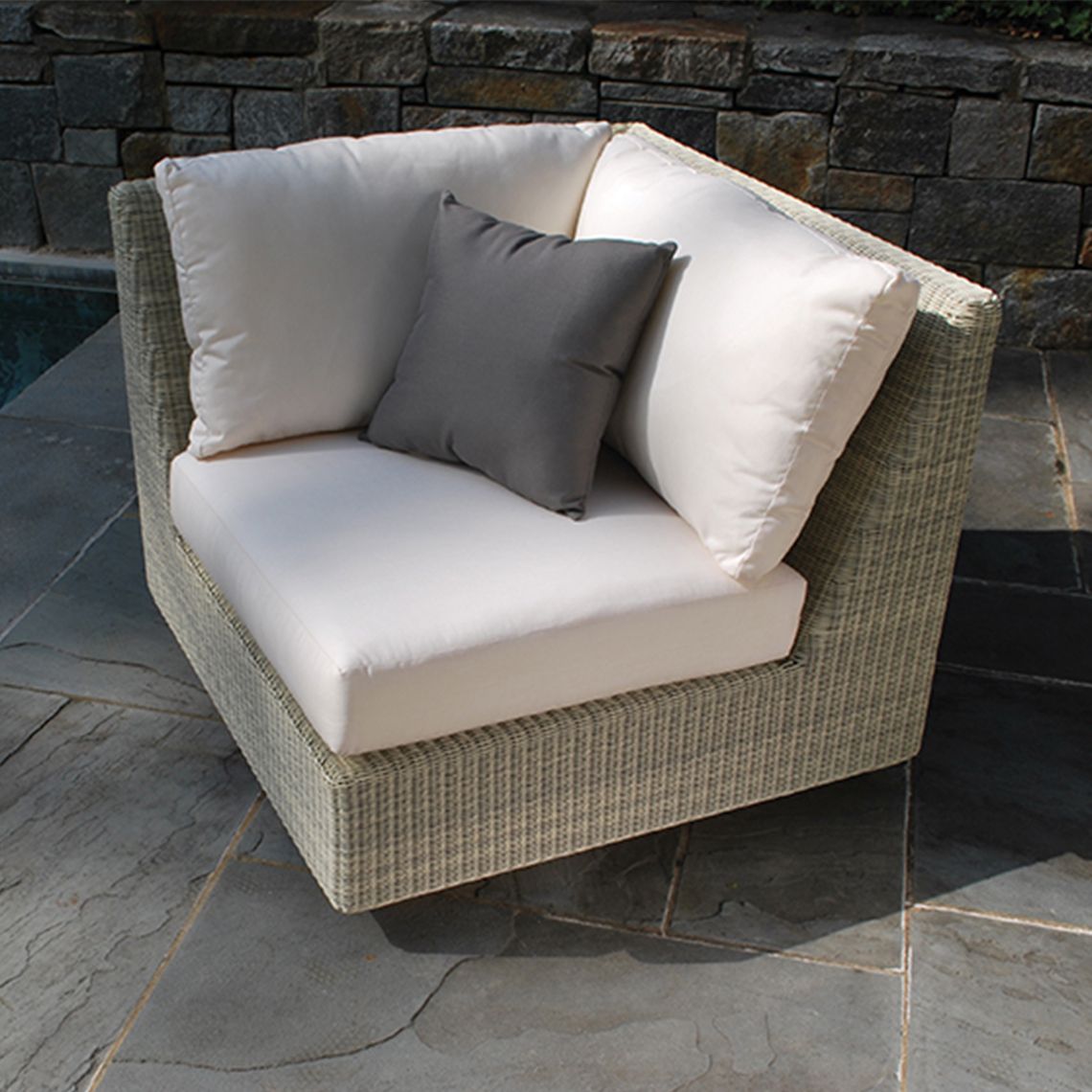 The Westport Sectional L/R Corner Chair, crafted from hand-woven wicker. Features streamlined simplicity with solid teak bases. Find a dealer near you. - alternate view