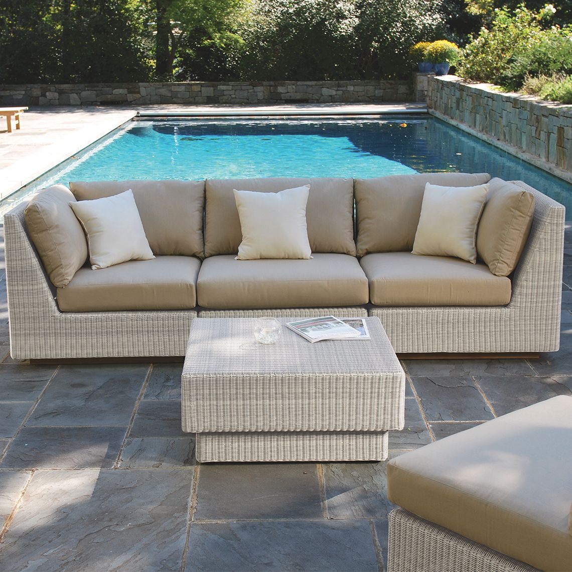 The Westport Sectional Armless Chair, crafted from hand-woven wicker. Features streamlined simplicity with solid teak bases. Find a dealer near you. - alternate view