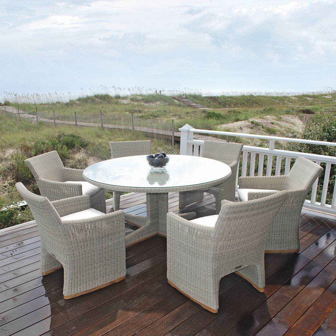 The Westport 60" Round Dining Table in hand-woven all-weather wicker. Streamlined simplicity with solid teak bases. By Kingsley Bate. Find a dealer near you. - alternate view