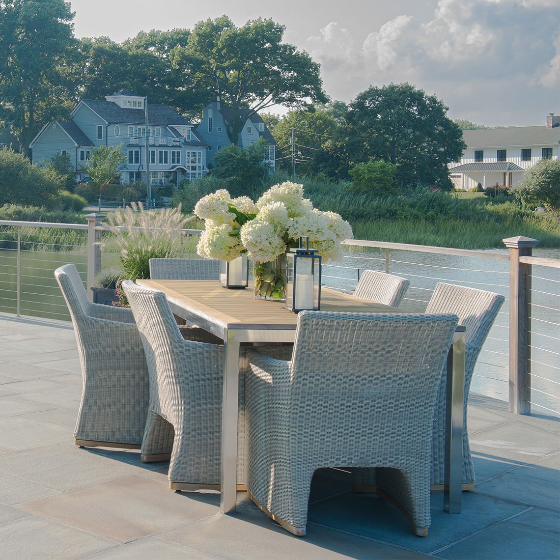 The Westport Dining Armchair in hand-woven all-weather wicker. Streamlined simplicity with solid teak bases. By Kingsley Bate. Find a dealer near you. - alternate view
